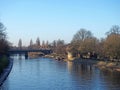 River ouse in york with trees and boats along the banks in afternoon sunlight Royalty Free Stock Photo