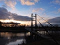 River and footbridge in sunset time, Lithuania Royalty Free Stock Photo