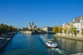 River of Paris with boats and buildings summertime