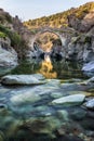 River passing through Genoese bridge at Asco in Corsica Royalty Free Stock Photo