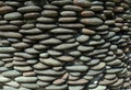 River pebble gravel round stone wall patterned for background. Royalty Free Stock Photo