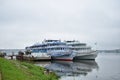 A river pier of the Russian Golden ring cruise vintage ships ships, the water surface reflected the thick Royalty Free Stock Photo