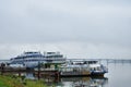 River port berth cruise ships, away bridge, fog low clouds Royalty Free Stock Photo