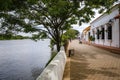 River promenade with typical historic houses, trees and river, Santa Cruz de Mompox, Colombia, World Heritage