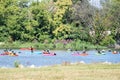 Diverse group of kayakers on river water