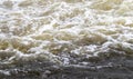 River rapids. Close up abstract background of falling water. Water flows over river rocks. A beautiful powerful stream Royalty Free Stock Photo