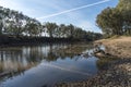 River reflections vapour trail