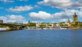 River rhine with Deutzer bridge, cruise ships, riverside cityscape with St. Martin church