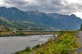 The river Rhine, a natural country border between municipalities of Vaduz in Liechtenstein and Sevelen in Switzerland