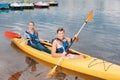 Blonde-haired woman joining her boyfriend for nice river ride