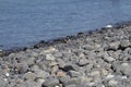 River Rocks, colors stone on Idyllic crystal seawater in front of luxury hotel, attractive clear sea, nature coastline backgrounds Royalty Free Stock Photo