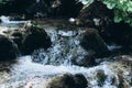 River rocks sitting in slow moving water