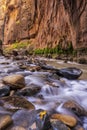 River Rounded Stones and Red Cliffs Royalty Free Stock Photo