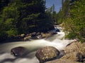 River Rushing Down a Dark Green Mountain Royalty Free Stock Photo