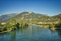 river Sarca, lake garda, Riva, Nago, Torbole. landscape with water, plants, mountains, blue sky Royalty Free Stock Photo