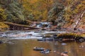 River scene in the forest surrounded by fall foliage Royalty Free Stock Photo