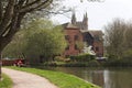 River scene with narrow boat & house