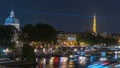 River Seine with Pont des Arts and Institut de France at night timelapse in Paris, France.