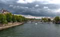 River Seine With Tourist Boat and Bridge Pont Neuf In Front Of Cathedral Notre Dame On Ile De La Cite In Paris, France Royalty Free Stock Photo