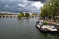 River Seine With Tourist Boat and Bridge Pont Neuf In Front Of Cathedral Notre Dame On Ile De La Cite In Paris, France Royalty Free Stock Photo
