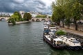 River Seine With Tourist Boat and Bridge Pont Neuf In Front Of Cathedral Notre Dame On Ile De La Cite In Paris, France Royalty Free Stock Photo