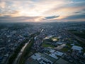 River separates suburban sprawl from rural farming area at sunrise Royalty Free Stock Photo