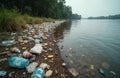 River shore littered with plastic bottles, garbage. Water pollution problem, ecological damage, environmental crisis. Floating Royalty Free Stock Photo