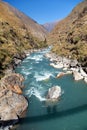 River and silhouette of rope hunging suspension bridge Royalty Free Stock Photo