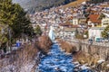 river through snowy alpine village Royalty Free Stock Photo