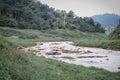 River stream flow on high mysterious mountainous deep jungle.Scenery of rainforest and river with rocks. Royalty Free Stock Photo