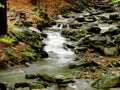 A river stream of water jumps over rocks. Royalty Free Stock Photo