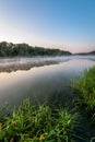 River at sunrise. the mist over the water. the vertical frame. Royalty Free Stock Photo