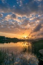 River sunset landscape with beautiful clouds, water reflection Royalty Free Stock Photo