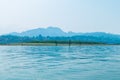 The river is surrounded by forests and mountains.