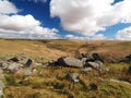 River Tavy cascades through Tavy Cleave with billowing clouds, Dartmoor National Park, Devon, UK