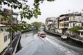 River taxi travels along the Bangkok canal to ferry passengers