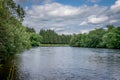 The river Tay surrounded by forests on either side. Royalty Free Stock Photo
