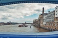 The River Thames and Butler`s Wharf Pier seen from the Tower Bridge of London, England
