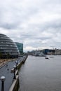 The river themes, riverside in sight, cloudy sky above.