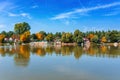 River Tisza and tiny houses at its riverbank in autumn