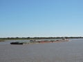 River Tug - Pusher `ASUNCION` and convoy of bardes loaded in navigation along of the Water Way Hidrovia rivers Paraguay Parana