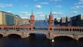 On the river between two towers. Tranquil aerial view flight