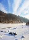 River under the ice, and all around fabulous snowy coniferous fo Royalty Free Stock Photo