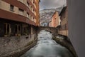 River Valira on Engordany Bridge and houses view in a snowfall day in small town Escaldes-Engordany in Andorra on January 16, 201