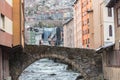 River Valira on Engordany Bridge and houses view in a snowfall day in small town Escaldes-Engordany in Andorra on January 16, 2013