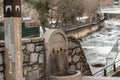 River Valira on Engordany Bridge and houses view in a snowfall day in small town Escaldes-Engordany in Andorra on January 16, 2013