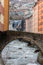 River Valira on Engordany Bridge and houses view in a snowfall day in small town Escaldes-Engordany in Andorra on January 16, 201