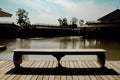 River view bench and antique wooden house Royalty Free Stock Photo