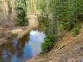 River view in early spring, beautiful cloud reflections in water Royalty Free Stock Photo