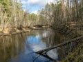 River view in early spring, beautiful cloud reflections in water Royalty Free Stock Photo